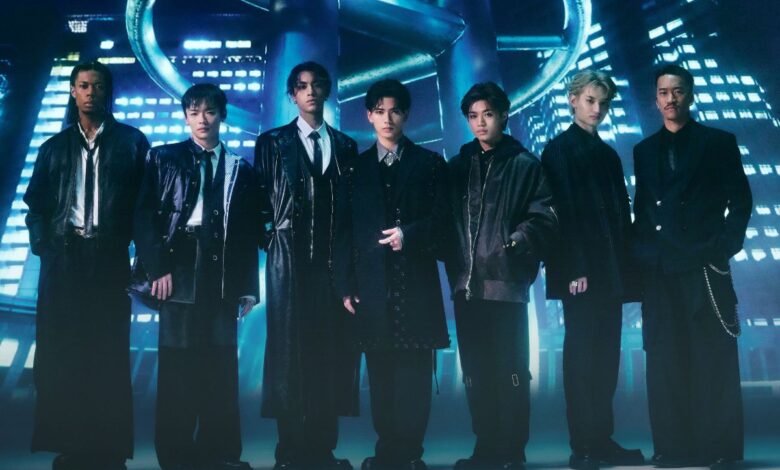 a group of men standing in front of a blue circle